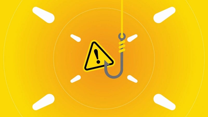 Warning icon on a phishing hook against a yellow background