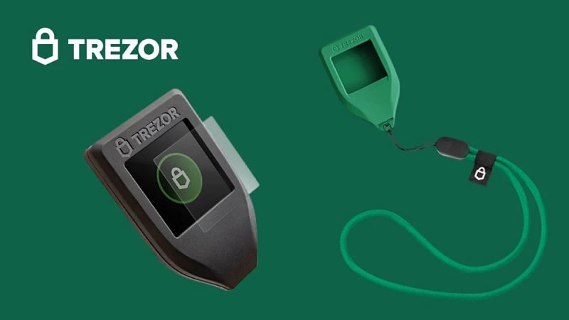 Trezor hardware wallet devices on a green background
