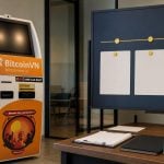 BitcoinVN BTM beside an operations transition board and hardware wallet package